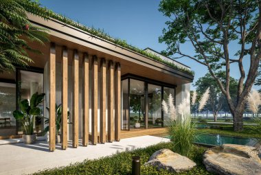 Otoparkı ve havuzu satılık ya da kiralık iki katlı evin beton cepheli ve arka planda güzel bir peyzajı var. Mavi gökyüzü açık güneşli bir yaz günü.