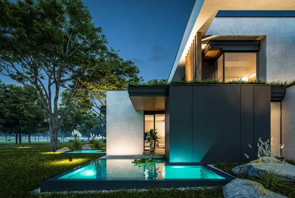 Park yeri ve havuzu satılık olan üç katlı bir ev. Ya da beton dış görünüş ve güzel peyzaj ile kiralanmış. Gökyüzünde bir sürü yıldızla berrak bir yaz gecesi