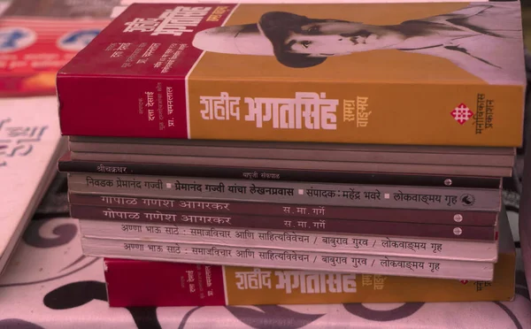 stock image street market with heap of books in the city of Pune, India