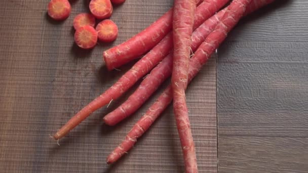 Fresh Sweet Sliced Carrot Wooden Background Close View — Vídeos de Stock