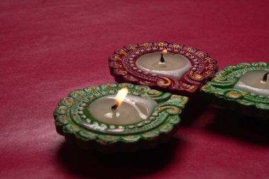 Close up view of candles on red background