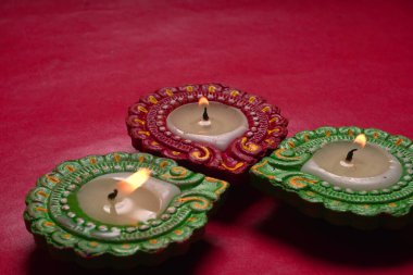 Close up view of candles on red background