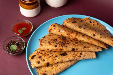 Healthy Indian Mooli or Radish paratha or stuffed flatbread with coriander and green chilli chutney