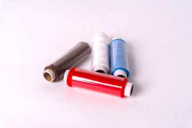 colorful sewing thread set on white background