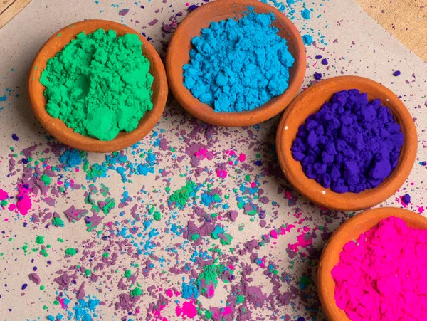 Colorful powders in clay pots for holi on occasion of indian festival of colors.