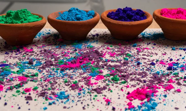 Colorful powders in clay pots for holi on occasion of indian festival of colors.