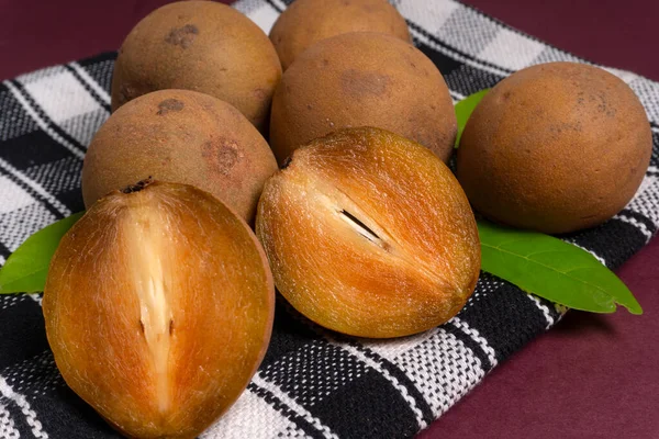 stock image Sapodilla fruit (Manilkara zapota) and other names such as sapota, chikoo, chico, naseberry, or nispero. Sapodilla is tropical fruit evergreen tree and sweet taste fruit.