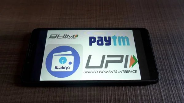 stock image mobile phone with paytm service on screen