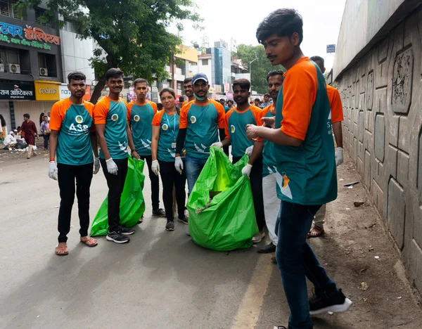 stock image volunteers cleaning the streets in india