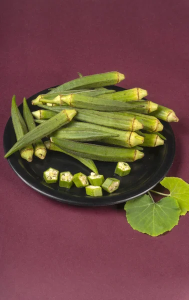 stock image fresh green indian okra on purple background