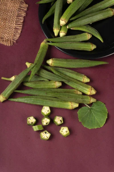 stock image fresh green indian okra on purple background