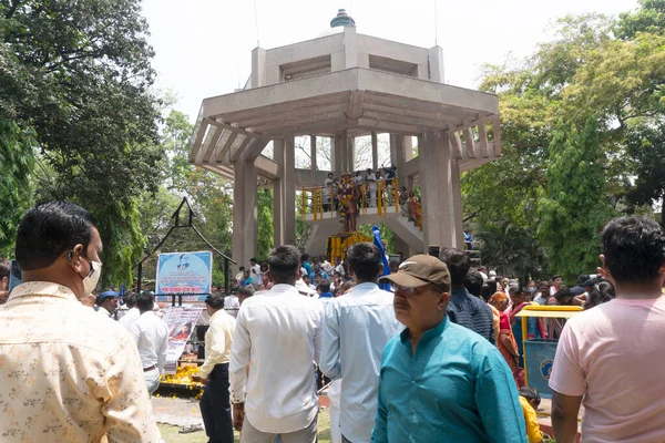 stock image Pune,India - 14 April 2022 : People garland and pay respect to Dr. B.R. Ambedkar, who wrote Indian constitution, statute on 131 anniversary celebrations.