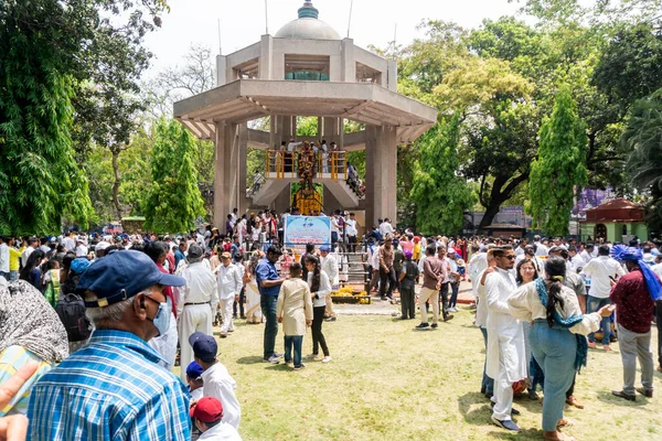 stock image Pune,India - 14 April 2022 : People garland and pay respect to Dr. B.R. Ambedkar, who wrote Indian constitution, statute on 131 anniversary celebrations.