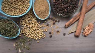 Indian Spices and herbs on wooden background. Food and cuisine ingredients
