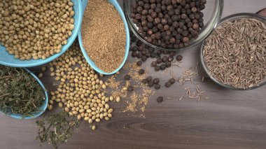 Indian Spices and herbs on wooden background. Food and cuisine ingredients