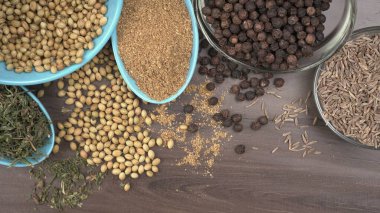 Indian Spices and herbs on wooden background. Food and cuisine ingredients
