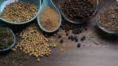 Indian Spices and herbs on wooden background. Food and cuisine ingredients
