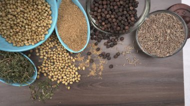 Indian Spices and herbs on wooden background. Food and cuisine ingredients