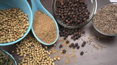 Indian Spices and herbs on wooden background. Food and cuisine ingredients