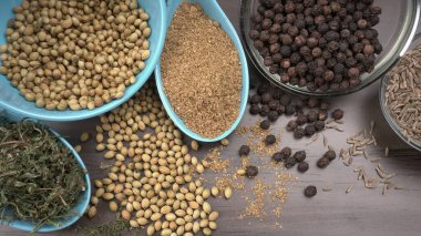Indian Spices and herbs on wooden background. Food and cuisine ingredients