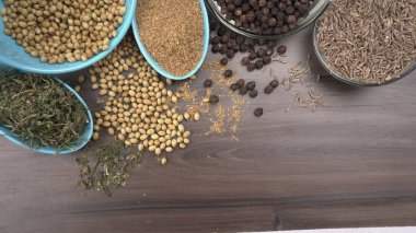 Indian Spices and herbs on wooden background. Food and cuisine ingredients