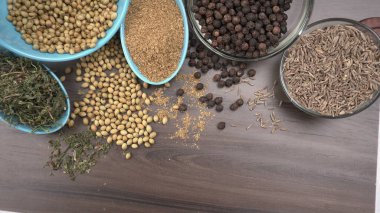 Indian Spices and herbs on wooden background. Food and cuisine ingredients