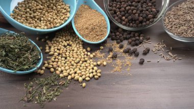 Indian Spices and herbs on wooden background. Food and cuisine ingredients