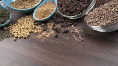 Indian Spices and herbs on wooden background. Food and cuisine ingredients