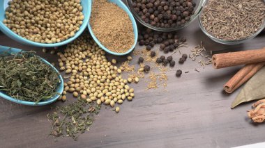 Indian Spices and herbs on wooden background. Food and cuisine ingredients