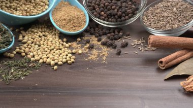 Indian Spices and herbs on wooden background. Food and cuisine ingredients