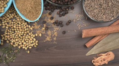 Indian Spices and herbs on wooden background. Food and cuisine ingredients