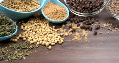 Indian Spices and herbs on wooden background. Food and cuisine ingredients