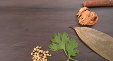 Indian Spices and herbs on wooden background. Food and cuisine ingredients