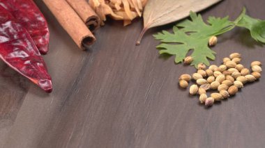Indian Spices and herbs on wooden background. Food and cuisine ingredients