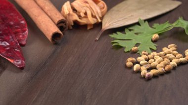 Indian Spices and herbs on wooden background. Food and cuisine ingredients