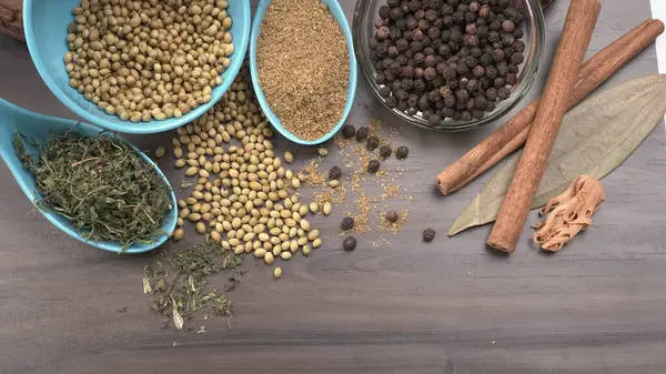 Indian Spices and herbs on wooden background. Food and cuisine ingredients