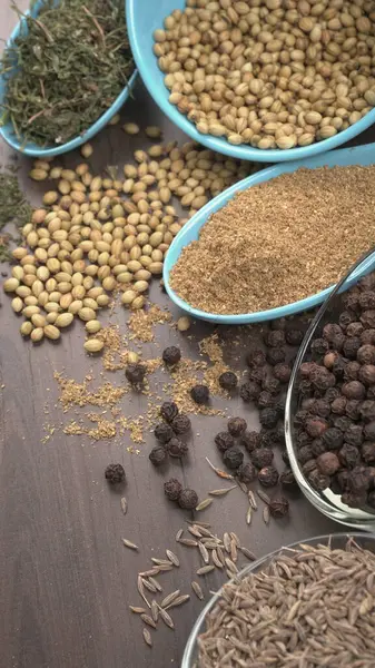 Indian Spices and herbs on wooden background. Food and cuisine ingredients