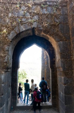 tourists at Sinhagad fort near Pune India. Sinhagad is an ancient hill fortress located at around 49 km southwest of the city of Pune, India clipart