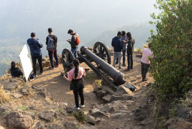 25 December 2021, Pune, Maharashtra, India - People at Lohagad fort, located at Lonavala, Maharashtra. It is famous for its breathtaking architecture view. clipart