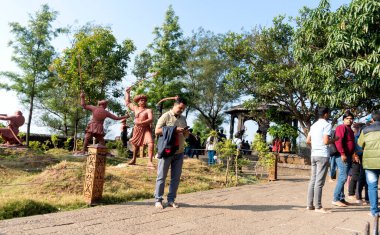 Pune, Maharashtra, India - December 10 2023: tourists visiting statues of maharashtra warriors in Sinhagad fort (Kondhana Killa) near Pune.  clipart