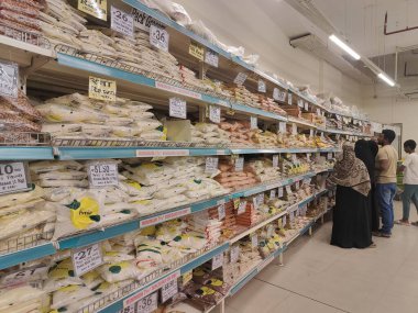 Pune, Maharashtra, India - January 13, 2025 ; A bustling grocery store aisle filled with a wide variety of food products. The shelves in the supermarket are stocked with colorful packaging for sell. clipart