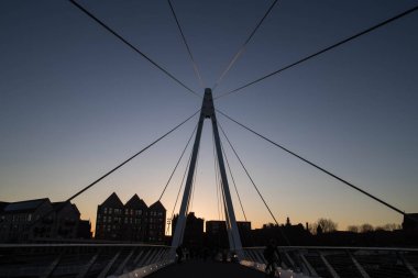 Govan to Partick Bridge, a fabricated steel cable stayed opening swing bridge, photo taken during sunset clipart