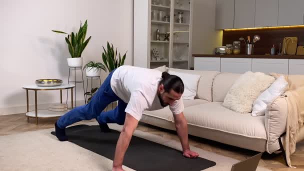 Sporty Man Having Workout Home Watching Online Training Program Mid — Vídeo de Stock