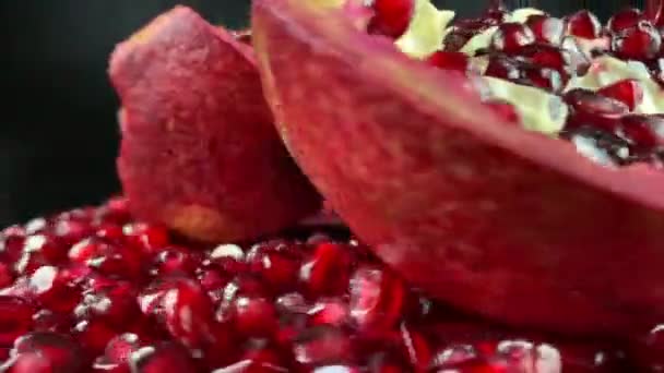 Close Rotating Open Pomegranate Pieces Ruby Arils Studio Light Juicy — Stock Video