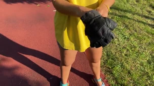 Multiracial Young Woman Puts Sport Gloves Preparing Vigorous Workout Picturesque — Stock Video