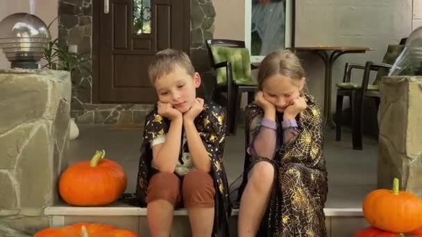 Disheartened Sad Children Halloween Costumes Sit Front Porch Adorned Spooky — Stock Video