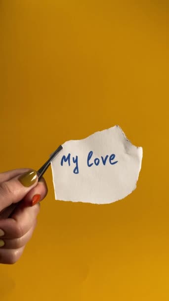 Poignant Concept Lost Love Female Hand Holds Paper Inscription Love — Stock Video