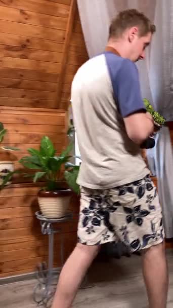 Vertical Shot Joyful Young Man Eagerly Prepares Vacation Indoors Packing — Stock Video