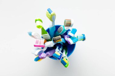 Holder with toothbrushes on white background. Oral hygiene.