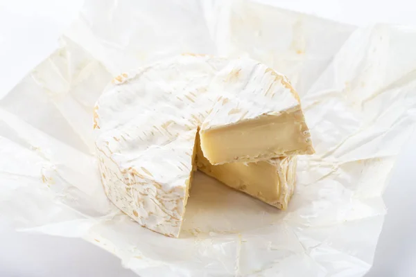 Camembert cheese on white background. French cheese.